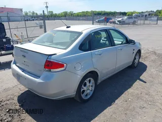 2008 Ford Focus SE with VIN 1FAHP35N88W271973, listed as a IAAI auction lot 42090204 with 261,457 mi miles. Bid and sale history available at carsss.com. Image 4.