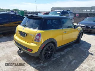 2009 MINI Hardtop S with VIN WMWMF73579TW86675, listed as a IAAI auction lot 42459385 with 129,264 mi miles and . Bid and sale history available at DreamBid. Image 4.