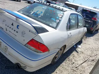 2002 Mitsubishi Lancer OZ-Rally with VIN JA3AJ86E42U039140, listed as a IAAI auction lot 41853888 with 328,181 mi miles. Bid and sale history available at carsss.com. Image 4.