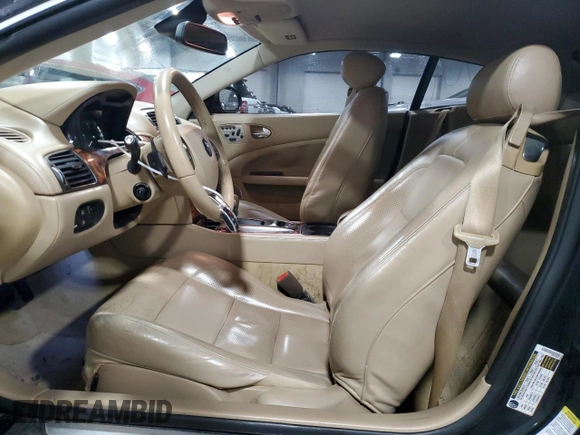 2007 Jaguar XK with VIN SAJWA43C479B18700, listed as a Copart auction lot 83377684 with 143,746 mi miles and Salvage Title. Bid and sale history available at carsss.com. Image 7.
