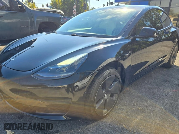 2021 Tesla Model 3 Standard Range Plus with VIN 5YJ3E1EA1MF871146, listed as a Copart auction lot 55633575 with 72,492 mi miles and Salvage Title. Bid and sale history available at DreamBid. Image 2.