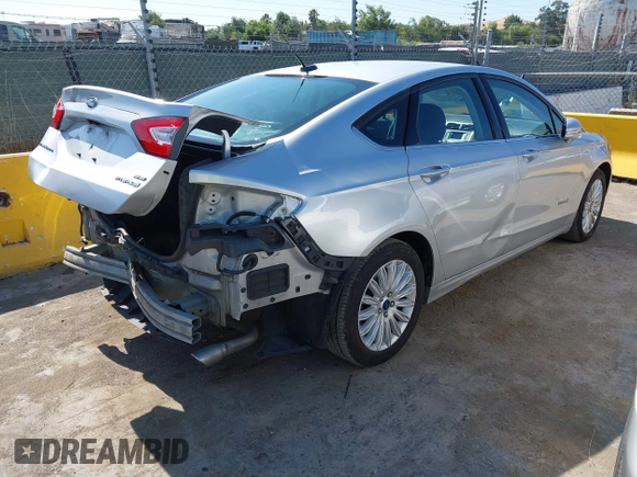 2015 Ford Fusion SE Hybrid with VIN 3FA6P0LUXFR296373, listed as a IAAI auction lot 42600980 with 76,985 mi miles and . Bid and sale history available at DreamBid. Image 4.