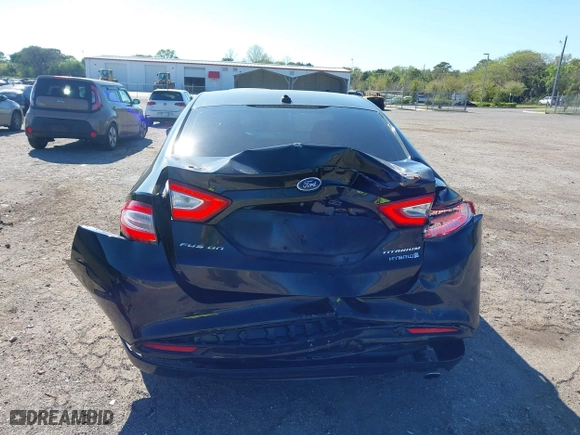 2015 Ford Fusion Titanium Hybrid with VIN 3FA6P0RUXFR119698, listed as a IAAI auction lot 41791411 with 140,646 mi miles. Bid and sale history available at carsss.com. Image 17.