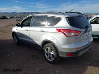 2014 Ford Escape SE with VIN 1FMCU9GX6EUB20308, listed as a IAAI auction lot 41818794 with 141,587 mi miles. Bid and sale history available at carsss.com. Image 3.