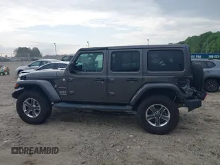 2018 Jeep Wrangler Unlimited Sahara with VIN 1C4HJXEN8JW303023, listed as a IAAI auction lot 42138631 with 72,463 mi miles and . Bid and sale history available at DreamBid. Image 14.