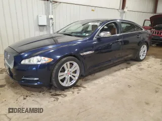 2014 Jaguar XJ Portfolio with VIN SAJWJ2GD7E8V67473, listed as a Copart auction lot 43968705 with 99,146 mi miles and Salvage title. Bid and sale history available at DreamBid. Image 1.