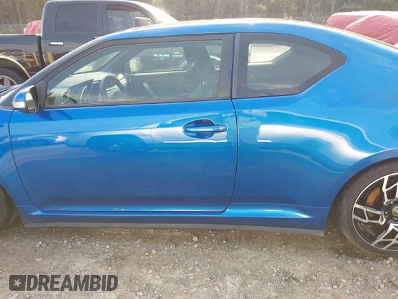 2014 Scion tC with VIN JTKJF5C72E3086001, listed as a IAAI auction lot 41721986 with 207,239 mi miles. Bid and sale history available at carsss.com. Image 14.