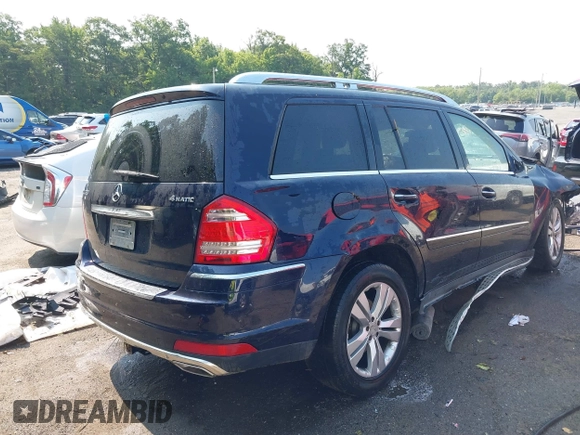 2011 Mercedes-Benz GL-Class GL 450 with VIN 4JGBF7BE8BA627367, listed as a IAAI auction lot 39992230 with 153,606 mi miles. Bid and sale history available at carsss.com. Image 4.