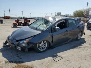 2021 Toyota Prius L Eco z VIN JTDKAMFU2M3147965, wystawiony jako Copart lot #51683465 z przebiegiem 109 055 mil mil oraz Szkoda całkowita • Salvage title. Historia ofert i sprzedaży dostępna na DreamBid. Obrazek 1.