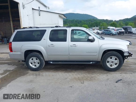 2011 Chevrolet Suburban LT with VIN 1GNSKJE32BR330742, listed as a IAAI auction lot 42435335 with 191,663 mi miles and . Bid and sale history available at DreamBid. Image 14.