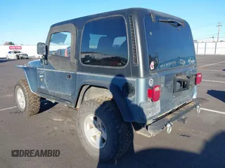 1998 Jeep Wrangler Sport with VIN 1J4FY19S4WP716469, listed as a IAAI auction lot 41506513 with 142,289 mi miles. Bid and sale history available at carsss.com. Image 3.
