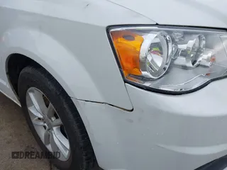 2015 Dodge Grand Caravan SXT with VIN 2C4RDGCG2FR548433, listed as a IAAI auction lot 42121256 with 161,459 mi miles and . Bid and sale history available at DreamBid. Image 12.