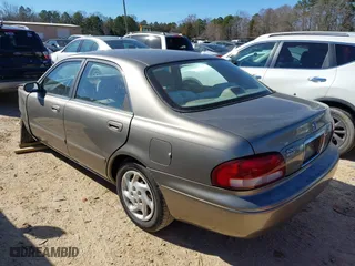 1999 Mazda 626 LX with VIN 1YVGF22D8X5871485, listed as a IAAI auction lot 41641049 with 115,603 mi miles. Bid and sale history available at carsss.com. Image 3.