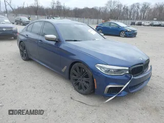 2018 BMW 5 Series M550i xDrive with VIN WBAJB9C56JG463891, listed as a IAAI auction lot 41731556 with 104,860 mi miles. Bid and sale history available at carsss.com. Image 1.