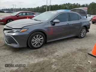 2024 Toyota Camry LE with VIN 4T1R11AK7RU857802, listed as a Copart auction lot 43718215 with 71,375 mi miles and Salvage Title. Bid and sale history available at carsss.com. Image 1.