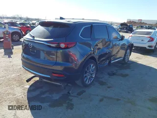 2023 Mazda CX-9 Carbon Edition z VIN JM3TCBDY2P0633889, wystawiony jako IAAI lot #41804791 z przebiegiem 20 454 mil mil oraz . Historia ofert i sprzedaży dostępna na DreamBid. Obrazek 4.