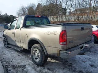 2003 Ford F-150 XL with VIN 2FTRX18W73CB07559, listed as a IAAI auction lot 41452402 with 152,509 mi miles. Bid and sale history available at carsss.com. Image 3.