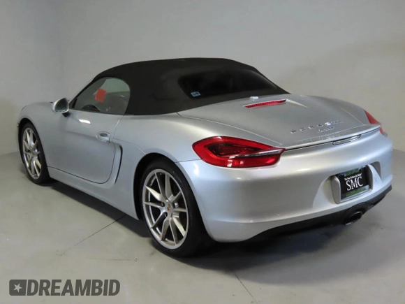 2014 Porsche Boxster with VIN WP0CA2A83ES120705, listed as a Copart auction lot 48166935 with 65,603 mi miles and Salvage title. Bid and sale history available at DreamBid. Image 4.