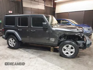 2018 Jeep Wrangler Unlimited Sport S with VIN 1C4HJXDG5JW126496, listed as a IAAI auction lot 42390584 with 163,476 mi miles and . Bid and sale history available at DreamBid. Image 14.