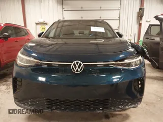 2023 Volkswagen ID.4 Pro z VIN 1V2DNPE84PC038042, wystawiony jako IAAI lot #41446269 z przebiegiem 12 878 mil mil oraz . Historia ofert i sprzedaży dostępna na DreamBid. Obrazek 13.