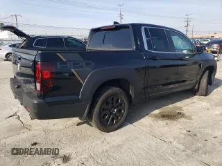 2023 Honda Ridgeline RTL with VIN 5FPYK3F52PB023574, listed as a Copart auction lot 44419565 with 15,205 mi miles and Salvage title. Bid and sale history available at DreamBid. Image 3.