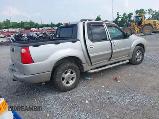 2003 Ford Explorer Sport Trac XLS z VIN 1FMZU77E73UB97392, wystawiony jako IAAI lot #42400398 z przebiegiem 160 556 mil mil oraz . Historia ofert i sprzedaży dostępna na DreamBid. Obrazek 4.