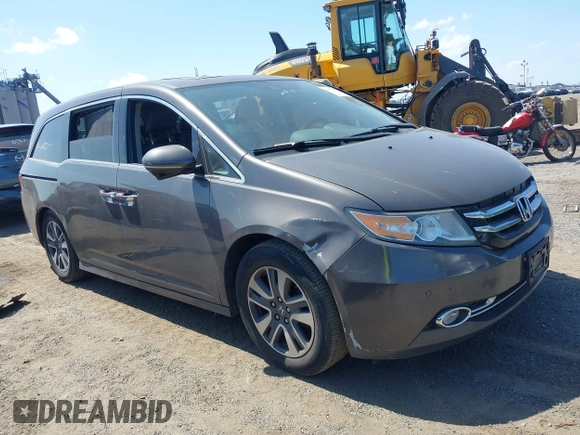 2014 Honda Odyssey Touring with VIN 5FNRL5H90EB082691, listed as a IAAI auction lot 42572977 with 54,413 mi miles and . Bid and sale history available at DreamBid. Image 1.