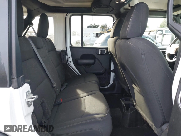 2023 Jeep Wrangler Sport with VIN 1C4HJXDG4PW567027, listed as a IAAI auction lot 41633197 with 14,782 mi miles and . Bid and sale history available at DreamBid. Image 8.