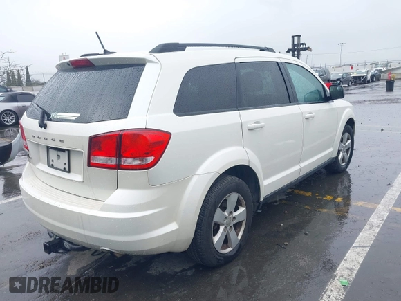 2013 Dodge Journey SE with VIN 3C4PDCAB1DT558033, listed as a IAAI auction lot 41804619 with 204,567 mi miles and . Bid and sale history available at carsss.com. Image 4.