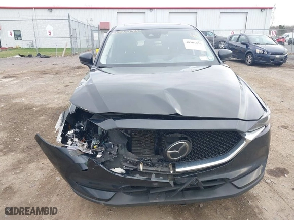 2021 Mazda CX-5 Grand Touring with VIN JM3KFBDMXM0456939, listed as a IAAI auction lot 40901055 with 113,540 mi miles. Bid and sale history available at carsss.com. Image 12.