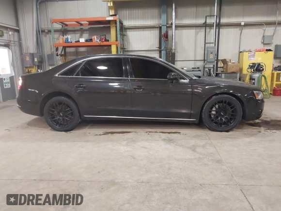 2012 Audi A8 z VIN WAURVAFD6CN014546, wystawiony jako IAAI lot #41357932 z przebiegiem 93 516 mil mil oraz . Historia ofert i sprzedaży dostępna na DreamBid. Obrazek 13.