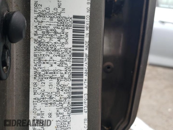 2013 Toyota Tacoma with VIN 3TMLU4EN5DM106850, listed as a Copart auction lot 61771865 with 153,507 mi miles and Salvage title. Bid and sale history available at DreamBid. Image 12.