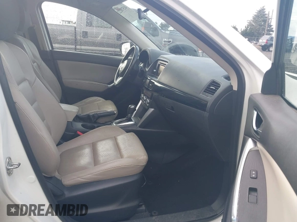 2015 Mazda CX-5 Grand Touring with VIN JM3KE4DY0F0483037, listed as a IAAI auction lot 41578222 with 102,988 mi miles. Bid and sale history available at carsss.com. Image 5.