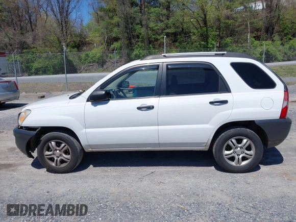 2006 Kia Sportage LX with VIN KNDJF723567151614, listed as a IAAI auction lot 42022102 with 128,564 mi miles and . Bid and sale history available at carsss.com. Image 14.