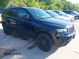 2017 Jeep Grand Cherokee Laredo with VIN 1C4RJFAGXHC817666, listed as a IAAI auction lot 42036817 with 119,698 mi miles. Bid and sale history available at carsss.com. Image 1.