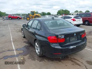 2012 BMW 3 Series 328i with VIN WBA3A5G51CNP17522, listed as a IAAI auction lot 42124868 with 154,385 mi miles and . Bid and sale history available at carsss.com. Image 3.