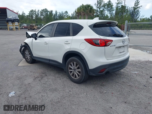 2015 Mazda CX-5 Touring with VIN JM3KE2CY8F0545967, listed as a IAAI auction lot 41909920 with 101,781 mi miles. Bid and sale history available at carsss.com. Image 3.