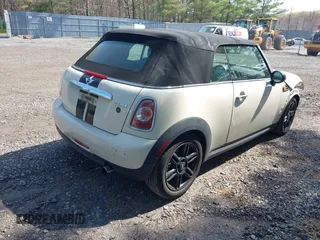 2013 MINI Convertible with VIN WMWZN3C58DT135598, listed as a IAAI auction lot 42122817 with 120,638 mi miles and . Bid and sale history available at DreamBid. Image 4.