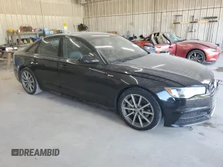 2016 Audi A6 Prestige with VIN WAUHGAFC2GN001442, listed as a Copart auction lot 61633805 with 128,140 mi miles and Salvage title. Bid and sale history available at DreamBid. Image 4.
