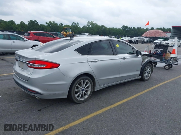2017 Ford Fusion Hybrid SE with VIN 3FA6P0LU2HR317784, listed as a IAAI auction lot 42618554 with 114,814 mi miles and . Bid and sale history available at DreamBid. Image 4.