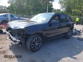 2021 BMW X3 sDrive30i z VIN 5UXTY3C00M9G70296, wystawiony jako IAAI lot #42295882 z przebiegiem 28 895 mil mil oraz . Historia ofert i sprzedaży dostępna na DreamBid. Obrazek 2.
