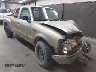 2000 Ford Ranger XL z VIN 1FTYR14V9YPB33928, wystawiony jako IAAI lot #41990787 z przebiegiem 158 143 mil mil oraz . Historia ofert i sprzedaży dostępna na DreamBid. Obrazek 1.