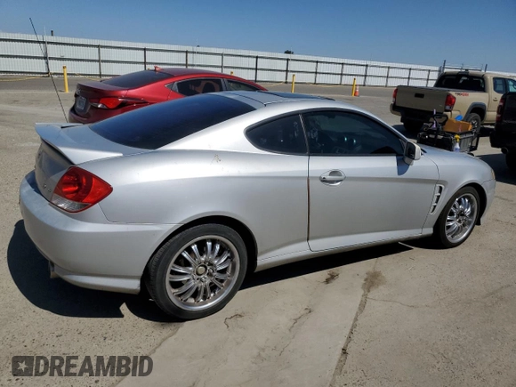 2006 Hyundai Tiburon GT z VIN KMHHN65F26U225506, wystawiony jako Copart lot #56997285 z przebiegiem 170 175 mil mil oraz Szkoda całkowita • Salvage title. Historia ofert i sprzedaży dostępna na DreamBid. Obrazek 3.