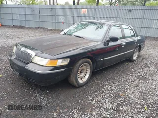 2002 Mercury Grand Marquis LS Premium z VIN 2MEFM75W42X644236, wystawiony jako IAAI lot #42276863 z przebiegiem 56 460 mil mil oraz . Historia ofert i sprzedaży dostępna na DreamBid. Obrazek 2.