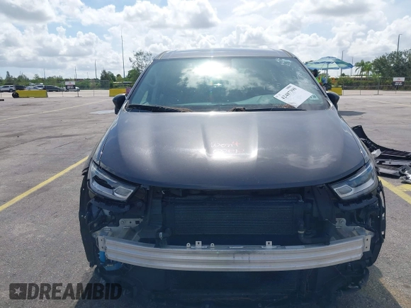 2023 Chrysler Pacifica Hybrid Touring L with VIN 2C4RC1L74PR579782, listed as a IAAI auction lot 42487390 with Not provided miles and . Bid and sale history available at DreamBid. Image 6.