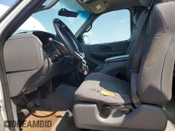 2002 Ford F-150 XL with VIN 1FTRX07W52KB08618, listed as a Copart auction lot 57941974 with 172,843 mi miles and Salvage title. Bid and sale history available at DreamBid. Image 7.