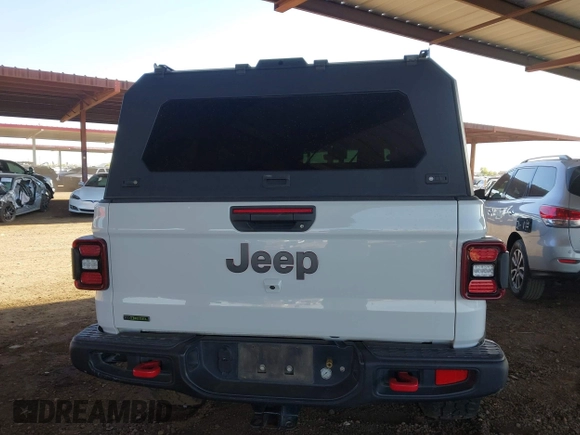 2022 Jeep Gladiator Rubicon with VIN 1C6JJTBM6NL145009, listed as a IAAI auction lot 42134143 with 59,438 mi miles and . Bid and sale history available at DreamBid. Image 16.