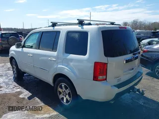 2011 Honda Pilot Touring with VIN 5FNYF4H96BB014095, listed as a IAAI auction lot 41794052 with 202,440 mi miles and . Bid and sale history available at DreamBid. Image 3.