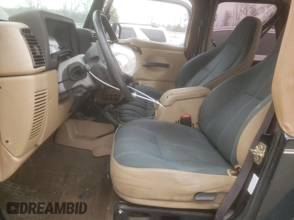 2002 Jeep Wrangler Sahara with VIN 1J4FA59S42P720513, listed as a Copart auction lot 47054805 with 190,922 mi miles and Salvage title. Bid and sale history available at DreamBid. Image 7.