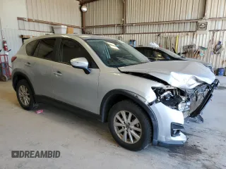 2016 Mazda CX-5 Touring with VIN JM3KE2CY0G0771566, listed as a Copart auction lot 52688255 with 142,204 mi miles and Salvage Title. Bid and sale history available at carsss.com. Image 4.